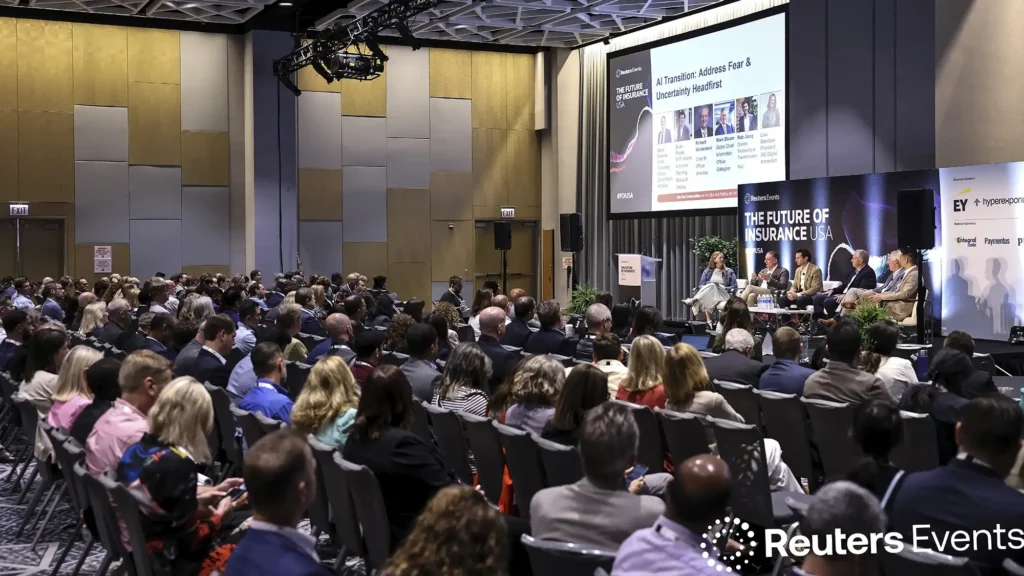 Chicago, Illinois convention photography of a six speaker panel on stage at the Reuters Events Future of Insurance USA conference.
