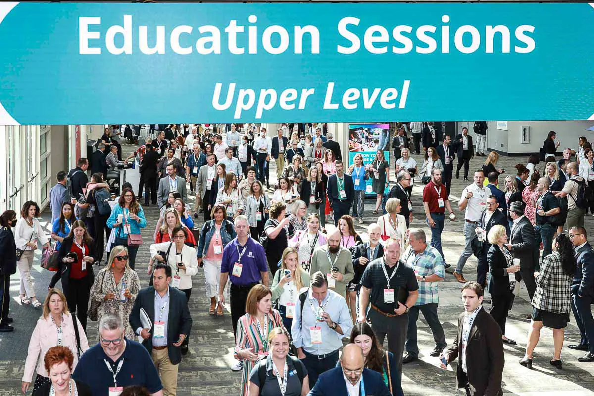 Crowded GBTA education session captured by a San Diego convention photographer as attendees fill the upper level hallway.