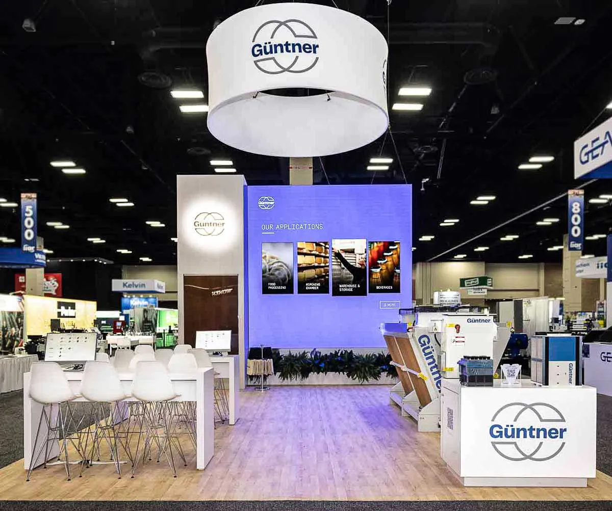 San Diego corporate exhibit photography showcasing a clean, empty Güntner trade show pavilion before the venue doors open.