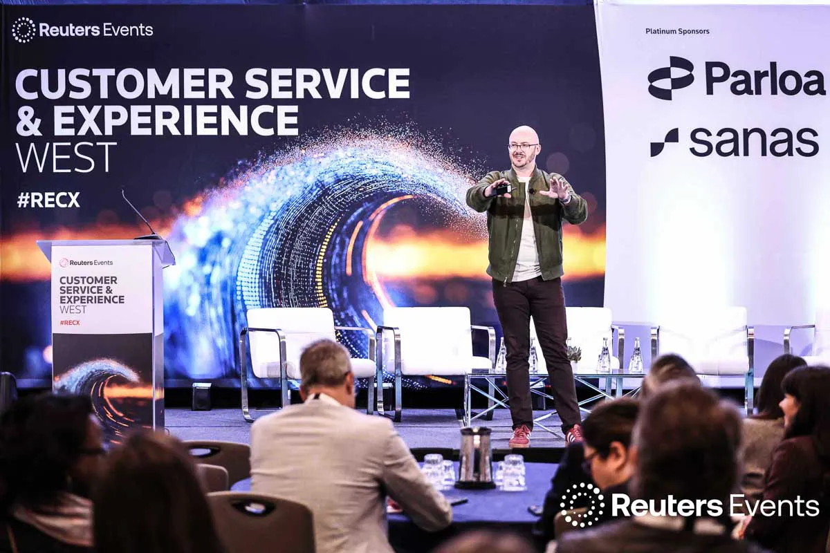 San Diego corporate event photography capturing a Reuters Events keynote speaker on stage at the Marriott La Jolla venue.