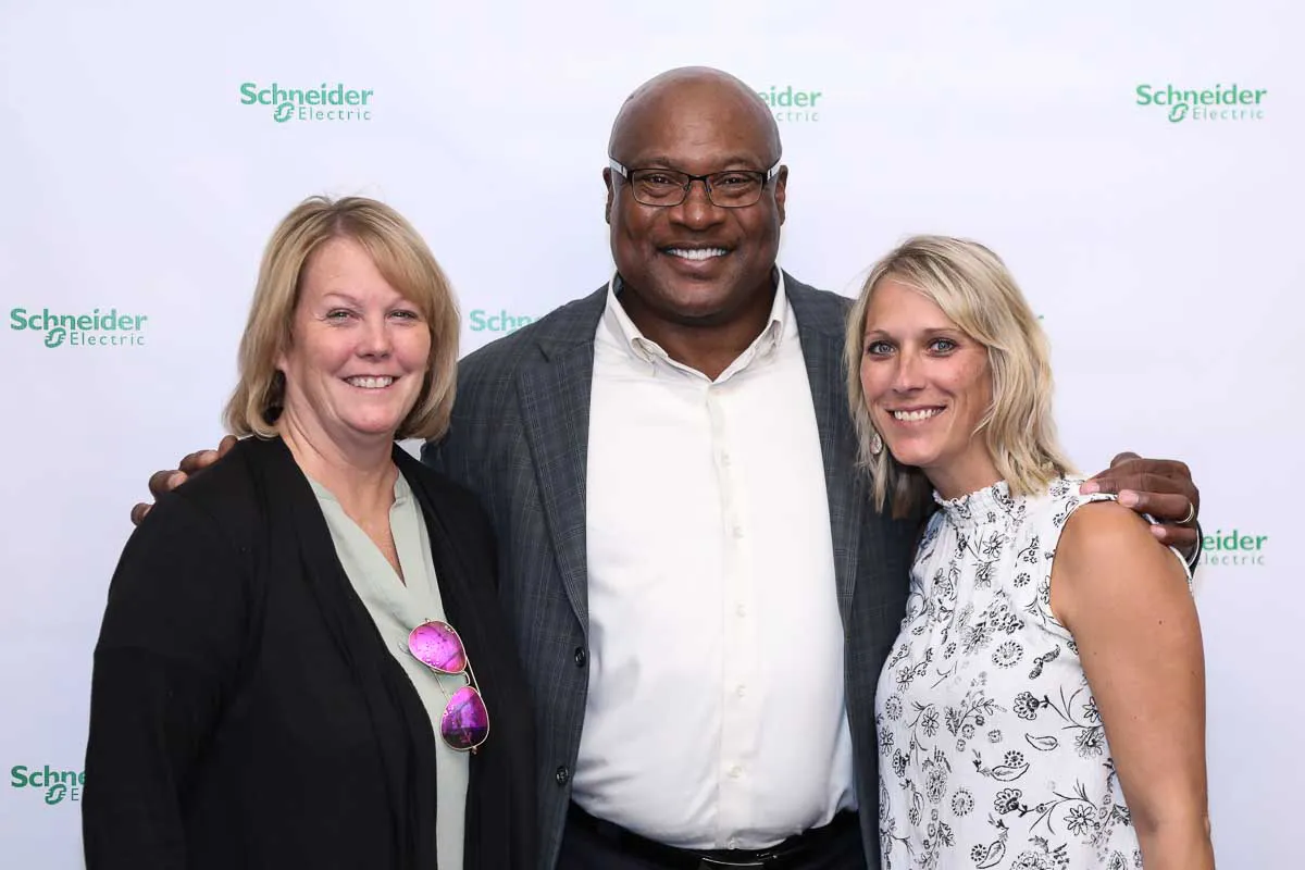 San Diego corporate event photography capturing an executive meet and greet with Bo Jackson at a Schneider step and repeat.