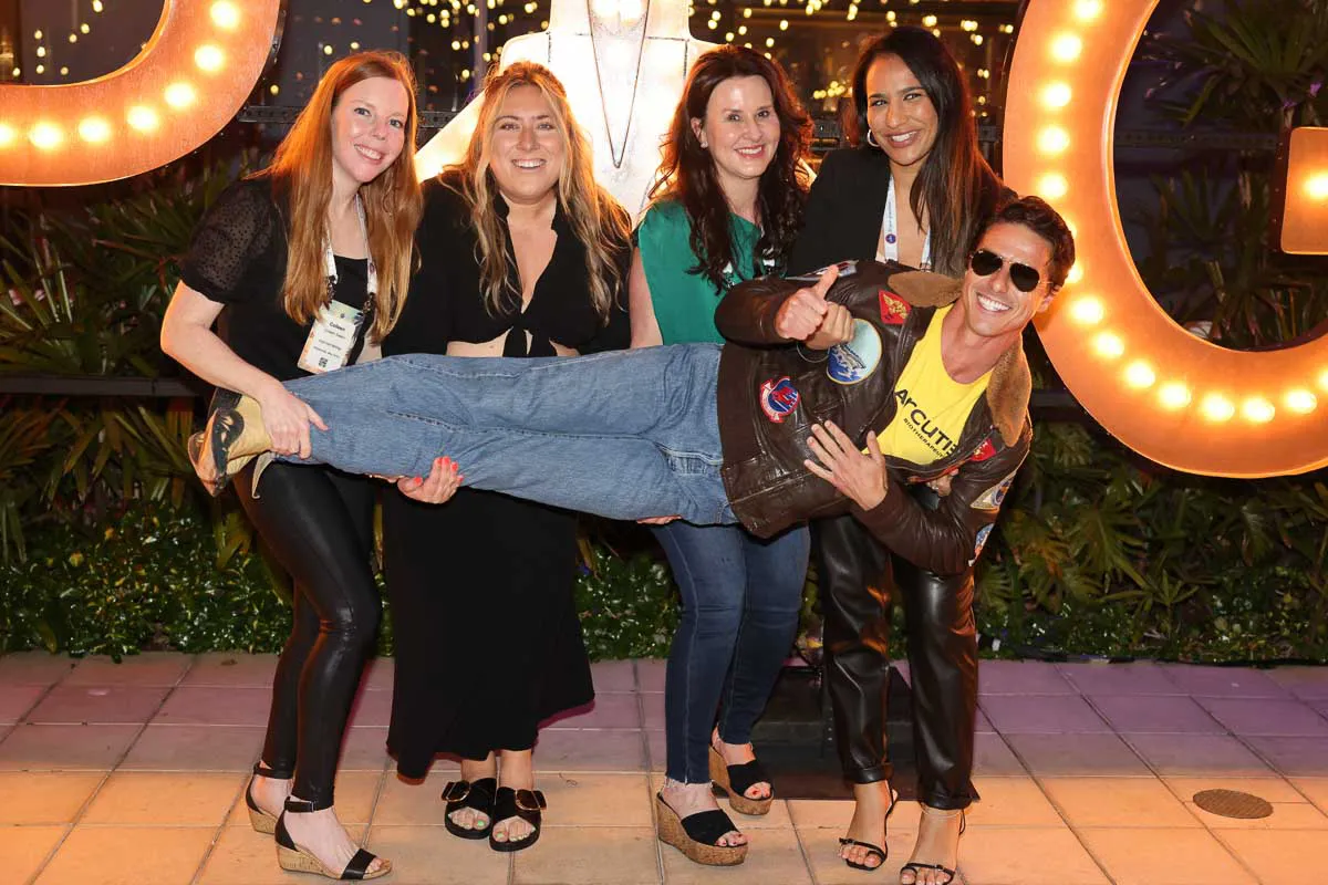 San Diego corporate evening event photography capturing a fun Tom Cruise lookalike pose at an SDPA closing reception.