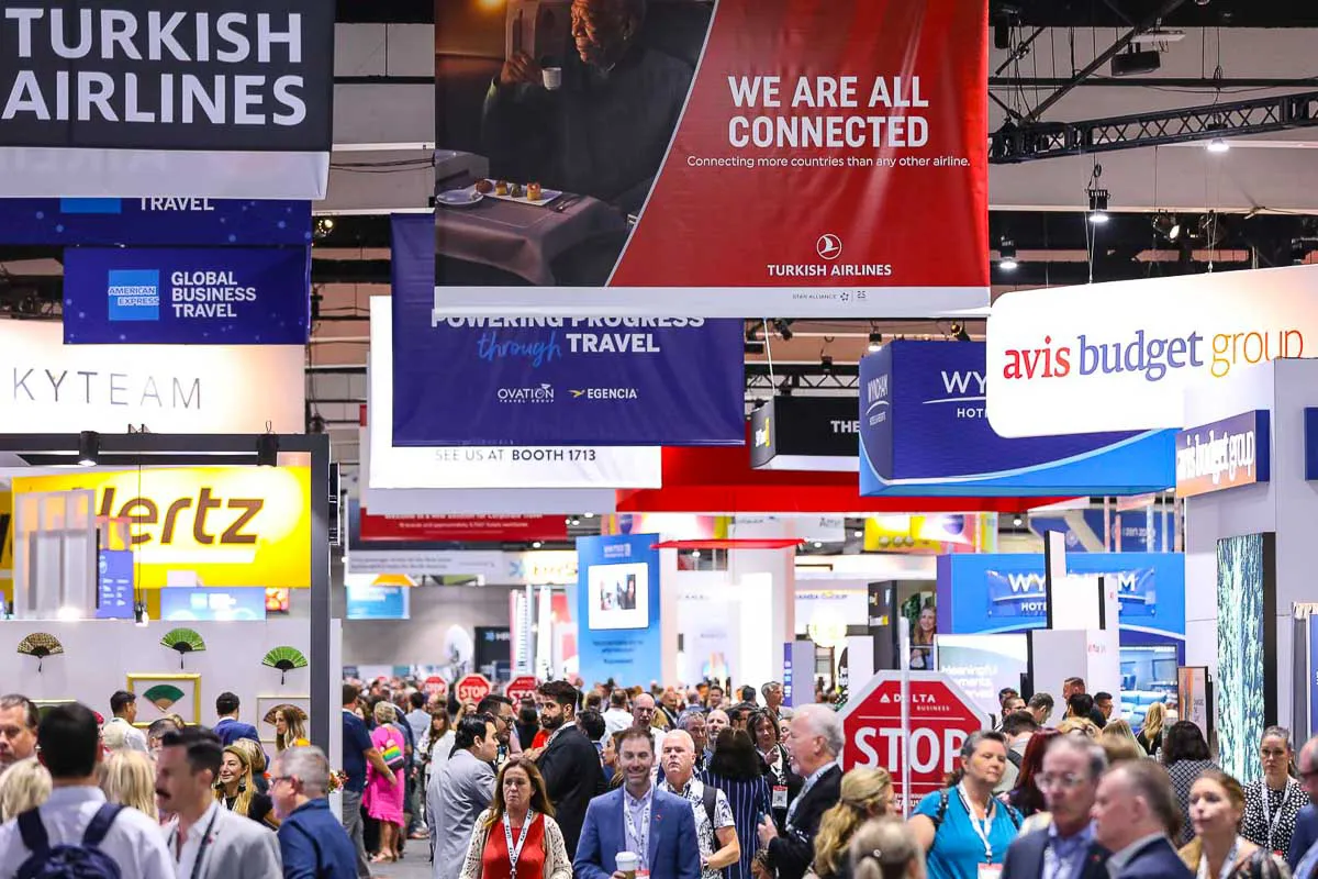 San Diego expo tradeshow photography showcasing a busy crowd under large Turkish Airlines and Avis Budget Group banners